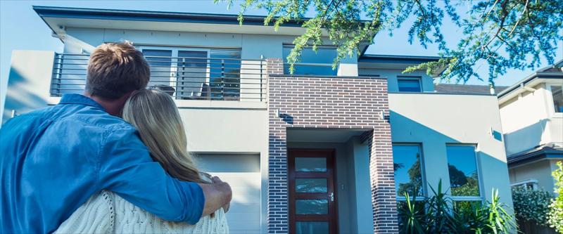 Family admiring new home
